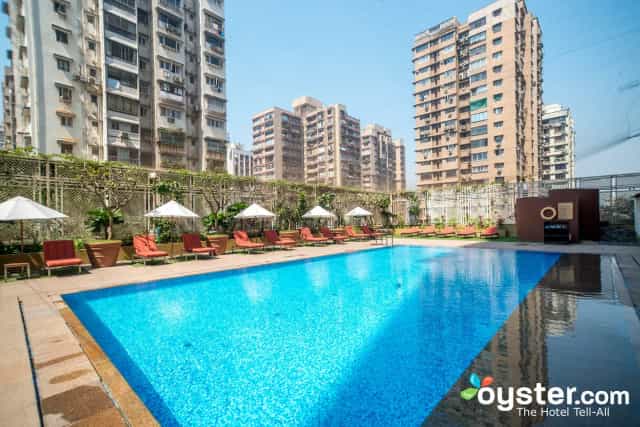 Lounge area with pool at Vivanta By Taj President, perfect for outdoor networking events.