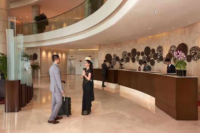 Sleek hotel lobby at Courtyard Mumbai Airport, ideal for events and networking.