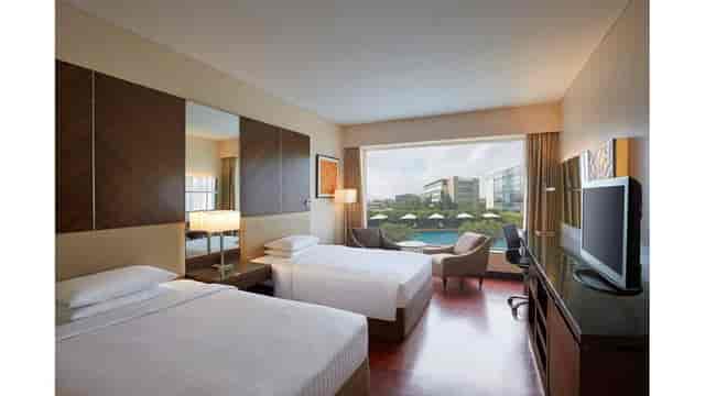Twin bed hotel room at CYM Lawns for business events near Mumbai Airport