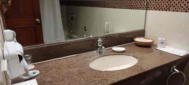 Bathroom counter at The Retreat Hotel, emphasizing cleanliness for events and meetings.