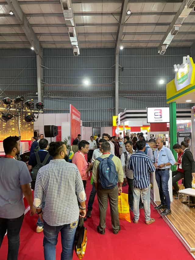 Alt tag: "Mumbai Exhibition Center bustling trade show with strategic booths and networking"
