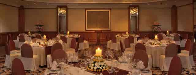 Elegant banquet hall setup in The Leela Mumbai for weddings and corporate events.