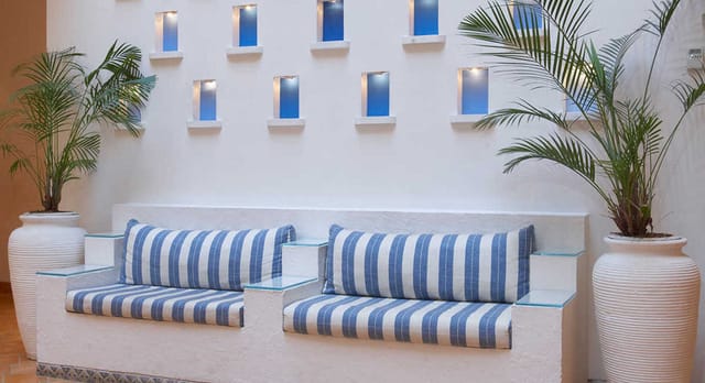 Lounge area in The Gordon House Hotel, stylish cushions, ideal for networking events.