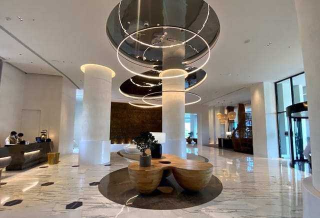 Modern lobby at Renaissance Mumbai, featuring elegant circular lighting for events.