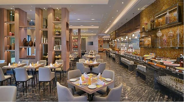 Hall + Pre Function Area, Radisson Mumbai: modern event space with natural light and dining options.