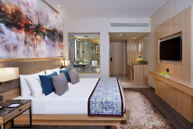 Modern hotel room at Radisson Mumbai, perfect for retreats and meetings.