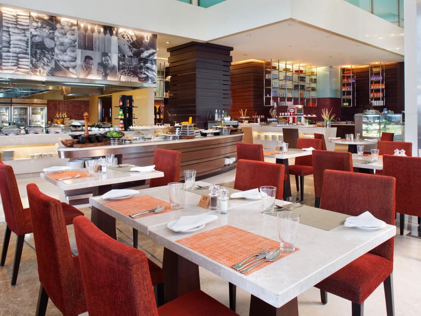 Sky Terrace dining at Holiday Inn Mumbai, modern decor for business events and gatherings.