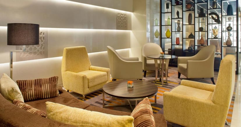 Sophisticated lounge in Holiday Inn Mumbai, perfect for conference networking.