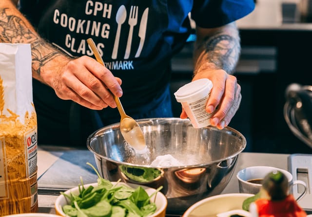 Cooking class setup with fresh ingredients for team-building and corporate wellness in CPH.