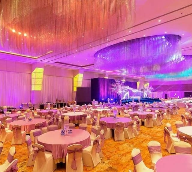 Elegant banquet hall with purple linens, ideal for galas and corporate events.