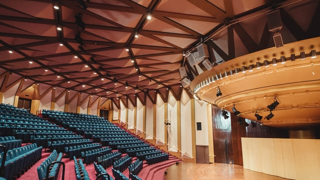 NCPA auditorium with tiered seating, ideal for meetings and conference events.