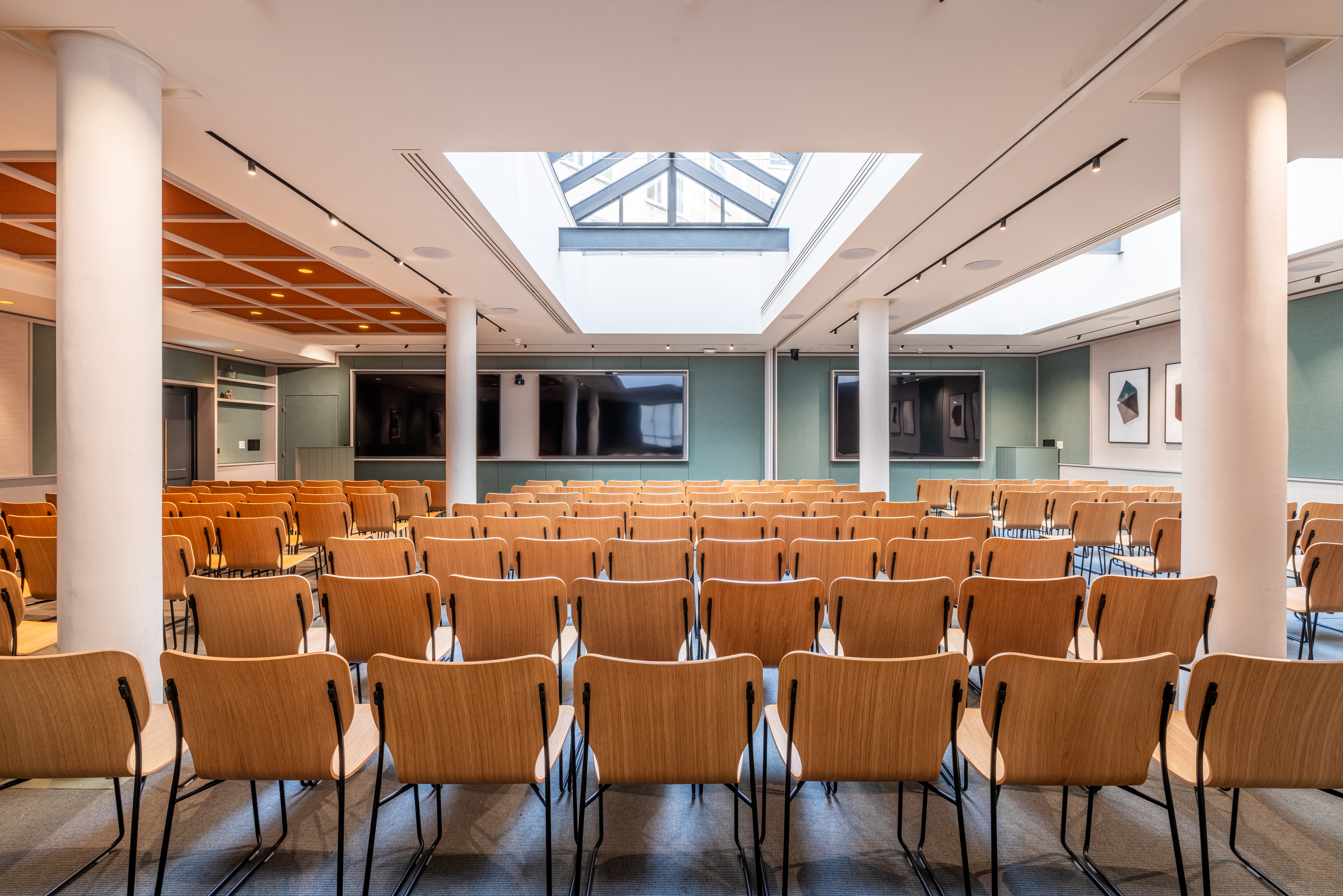 Spacious meeting venue with natural light, ideal for conferences and workshops.