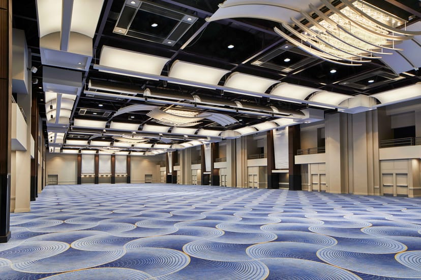 Centennial Ballroom at Hyatt Regency Atlanta, spacious event space with elegant chandeliers.