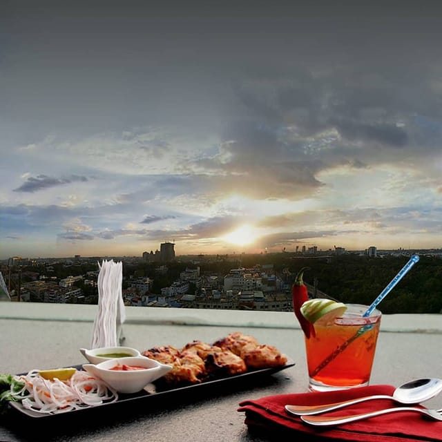 Rooftop bar with sunset view, elegant catering for events and social gatherings.