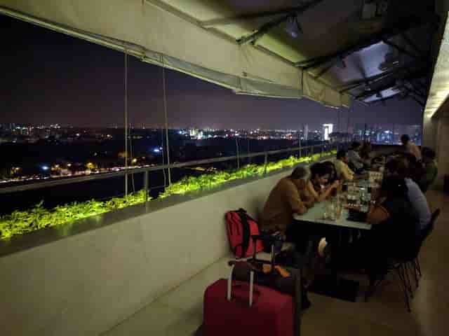 Rooftop event space at 13th Floor Bar with urban skyline for networking dinner.