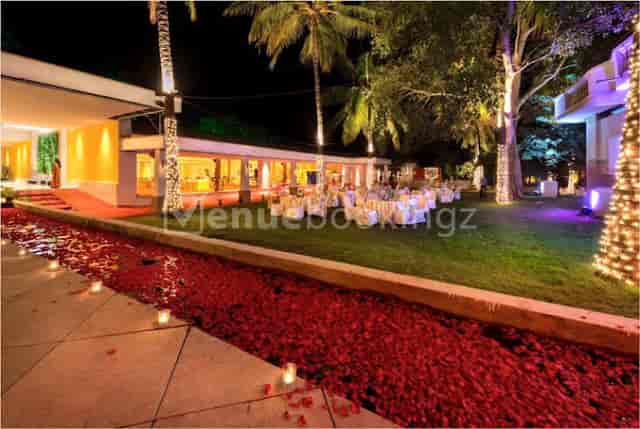 Opa Banquet Hall: elegant outdoor gala venue with ambient lighting and lush greenery.