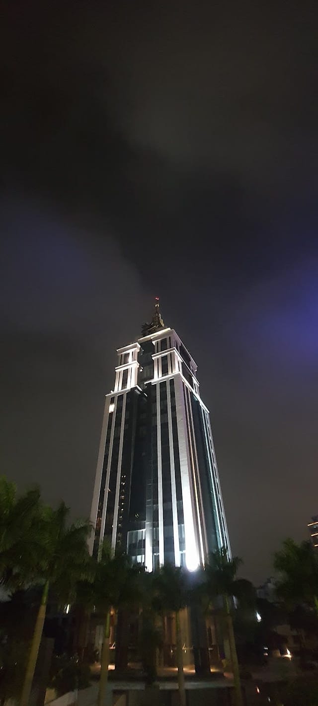 Illuminated skyscraper in The Executive Centre, ideal for corporate events in Bangalore.