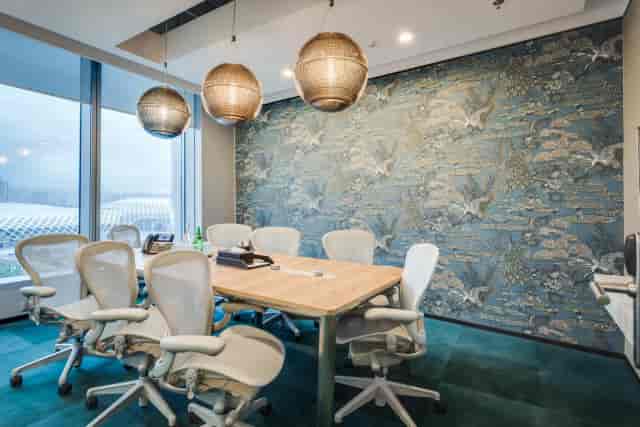 Modern conference room with wooden table, ideal for meetings and events in Bangalore.