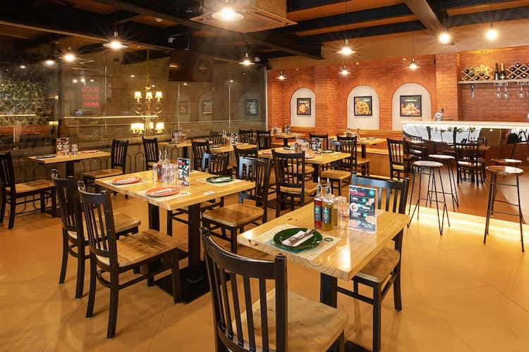 Stylish dining space at 14° 41° Pizzeria, perfect for networking events and meetings.