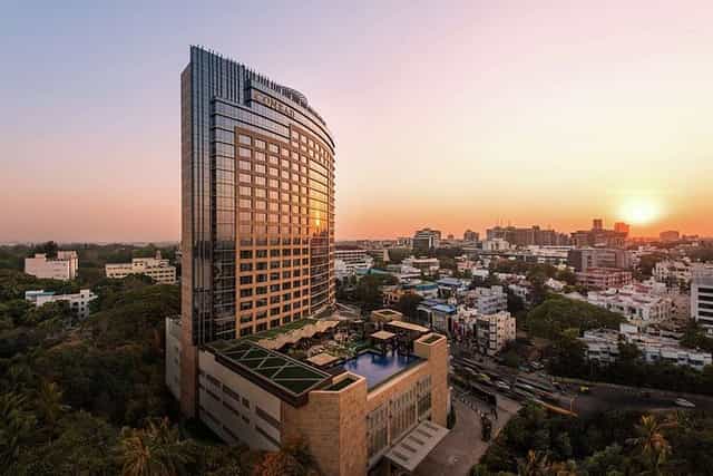 Modern banquet hall at Conrad Bengaluru, perfect for events with rooftop views at sunset.