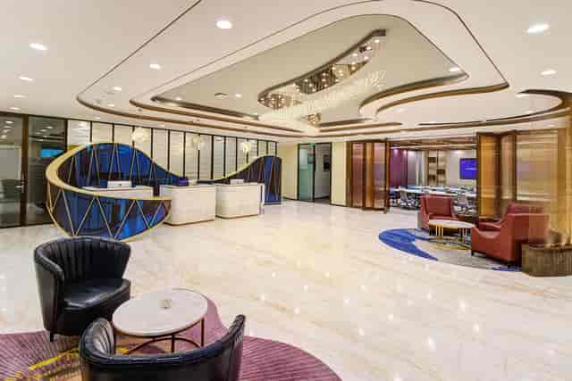 Modern event space lobby with sleek furniture for corporate meetings and networking.