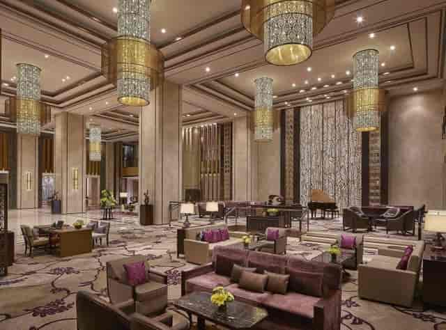 Elegant lobby of b Café with piano, ideal for upscale events and meetings.