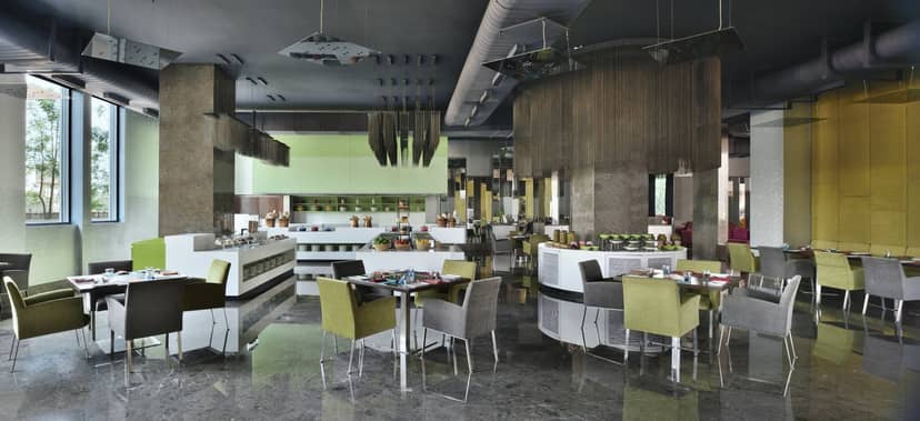 Modern dining area at Aloft Bengaluru for corporate meetings and events.