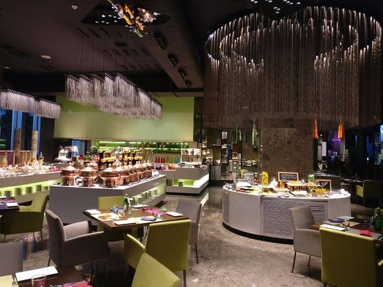 Modern dining venue in Aloft Bengaluru with buffet layout for events and gatherings.