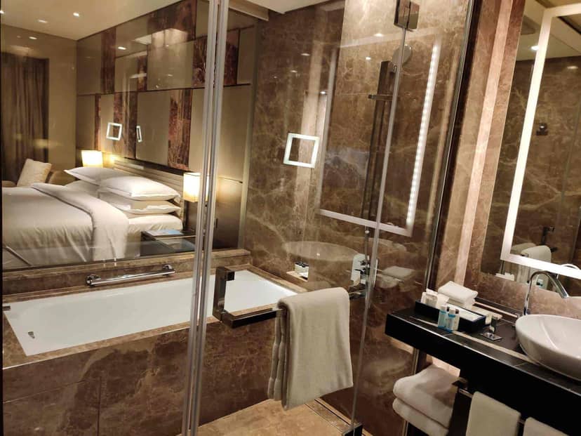 Luxurious marble hotel bathroom in Scarlet Ballroom, ideal for events and meetings.