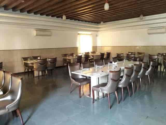Spacious dining area with modern seating at Blue Waters Lounge Bar for events and gatherings.