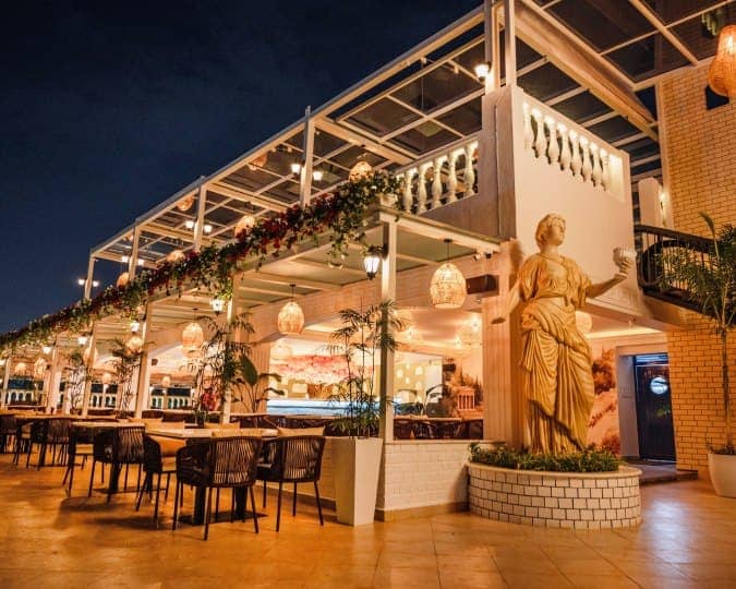 Elegant outdoor dining area with atmospheric lighting, perfect for events and celebrations.