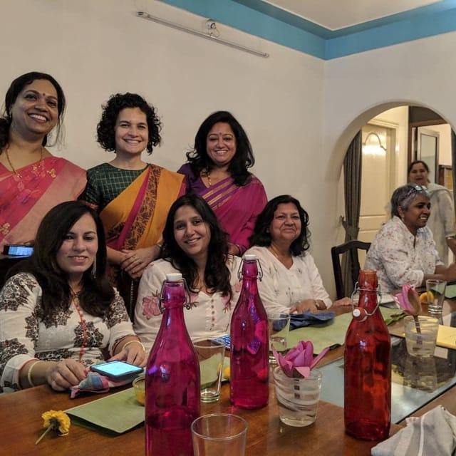 Vibrant women in colorful attire at Bengaluru Oota Company event, showcasing inclusivity and engagement.