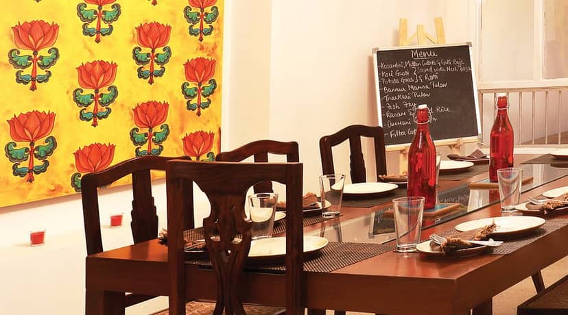 Cozy dining setup at Bengaluru Oota Company for intimate meetings and brainstorming events.