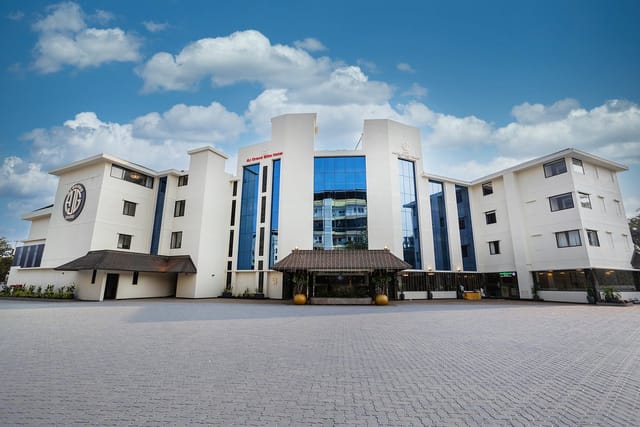 Modern corporate event venue, The Verda Saffron, with ample outdoor space and natural lighting.