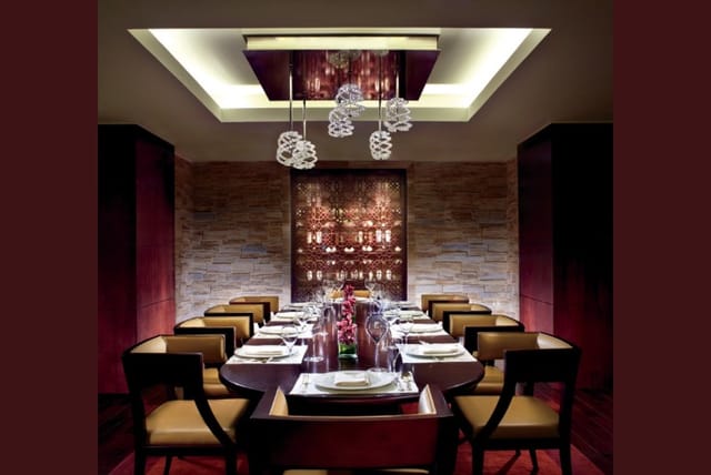 Elegant private dining room with sophisticated decor for exclusive meetings and events.