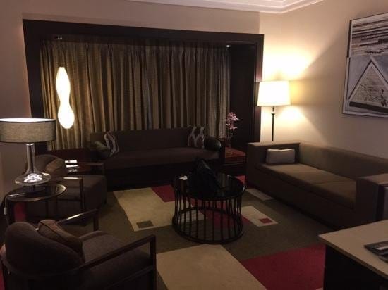 Stylish lounge area in JW Marriott Bengaluru for casual meetings and networking events.