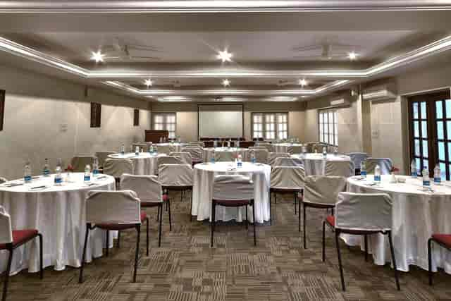 Conference Room at Windflower Resorts with round tables for professional events.