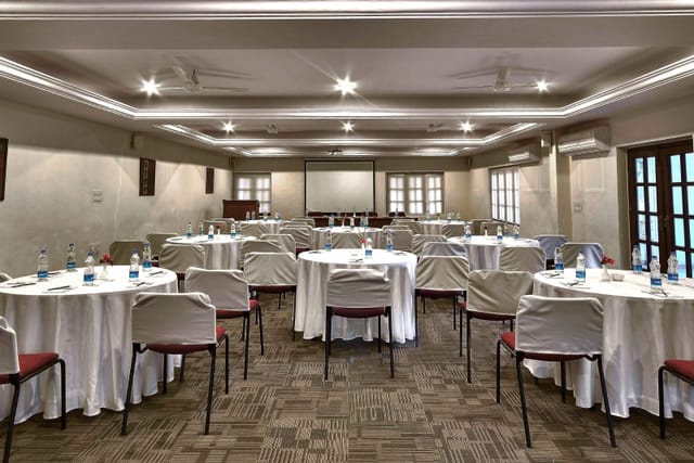 Conference Room at Windflower Resorts with round tables for professional events.