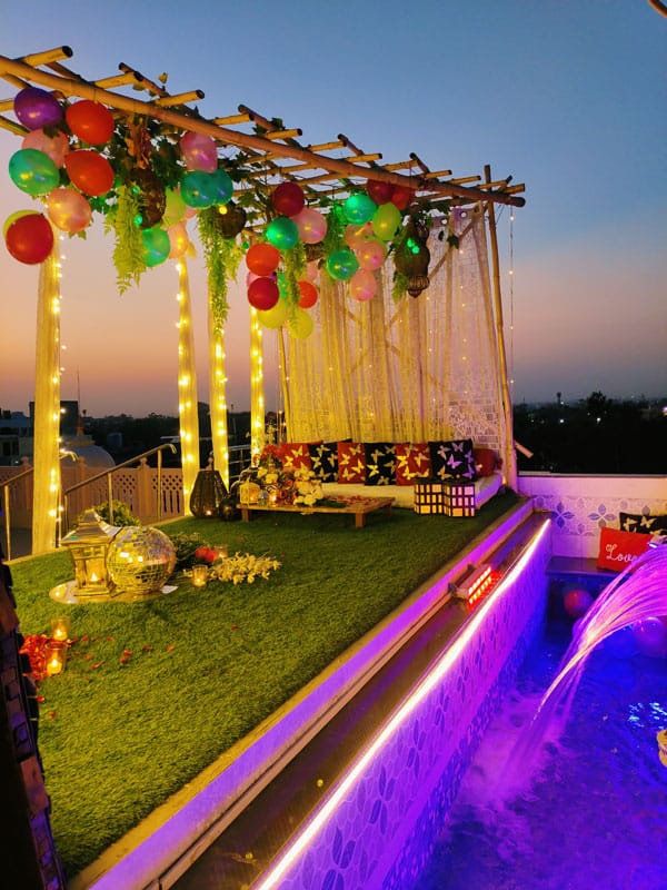 Private Peacock Garden Restro Lounge rooftop with vibrant decor for evening events.
