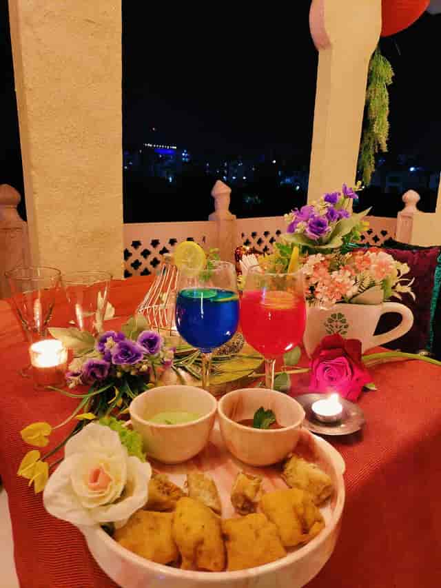 Private Lounge in Pakwaan Restaurant with vibrant cocktails and candlelit ambiance for gatherings.