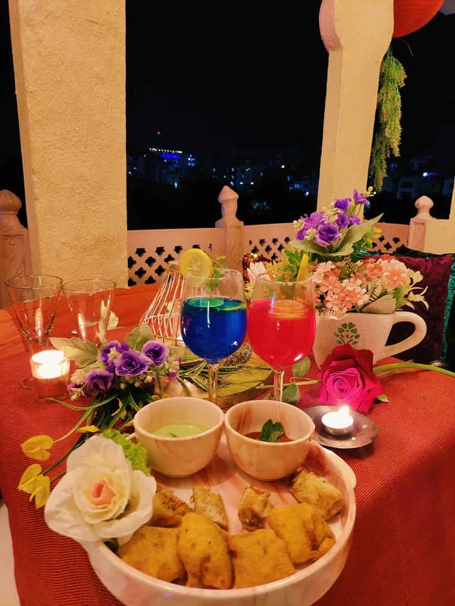 Private Lounge in Pakwaan Restaurant with vibrant cocktails and candlelit ambiance for gatherings.
