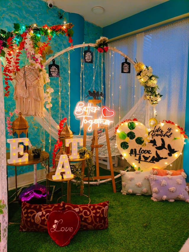 Tree Garden Indoor Restro Lounge: vibrant event space with floral decor for intimate celebrations.