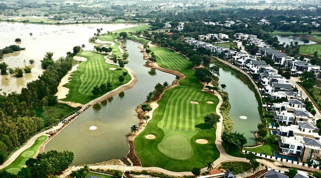 Aerial view of Prestige Golfshire golf course with serene waterways for events.
