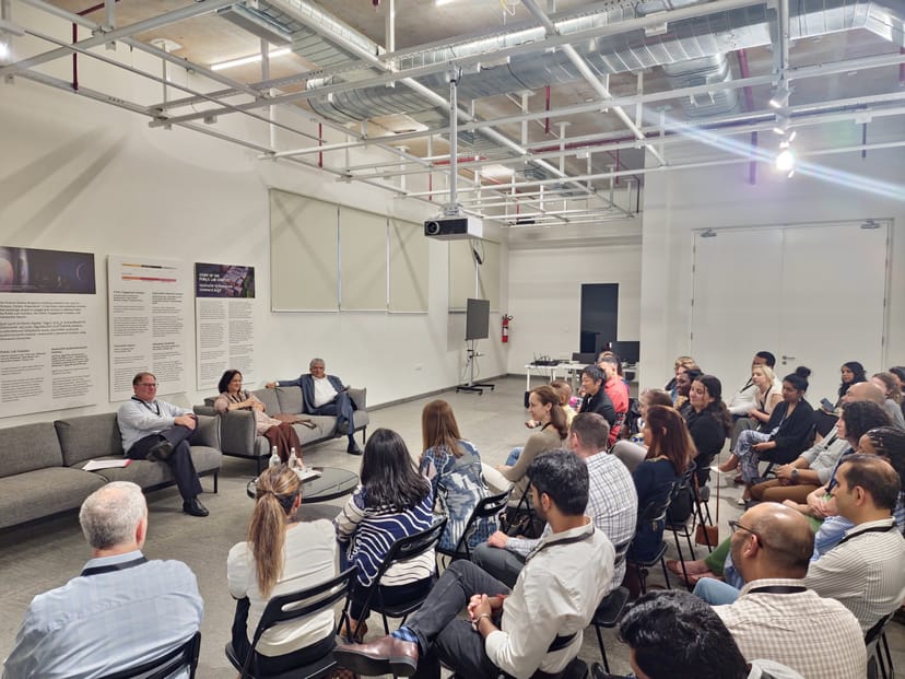"Modern conference room panel discussion in Science Gallery Bengaluru, perfect for networking."