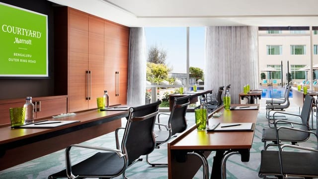 Modern conference room with sleek chairs, perfect for corporate events and meetings.