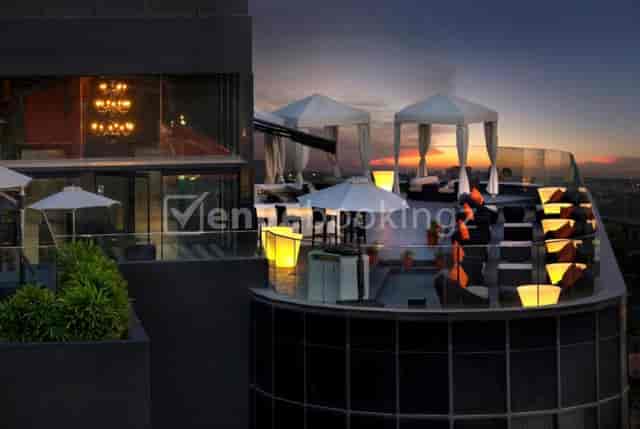 Rooftop event space at The Waverly Hotel, elegant cabanas and sunset view.