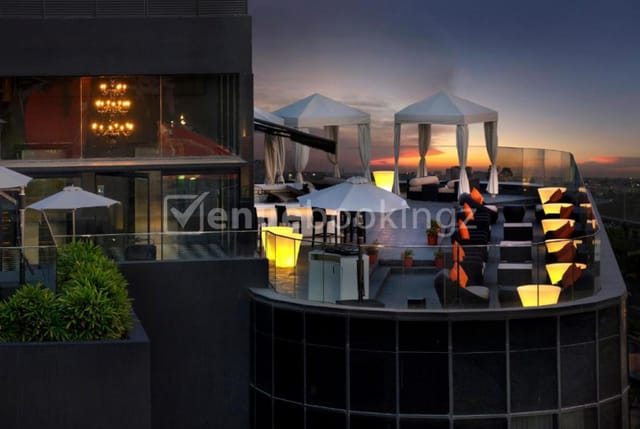 Rooftop event space at The Waverly Hotel, elegant cabanas and sunset view.