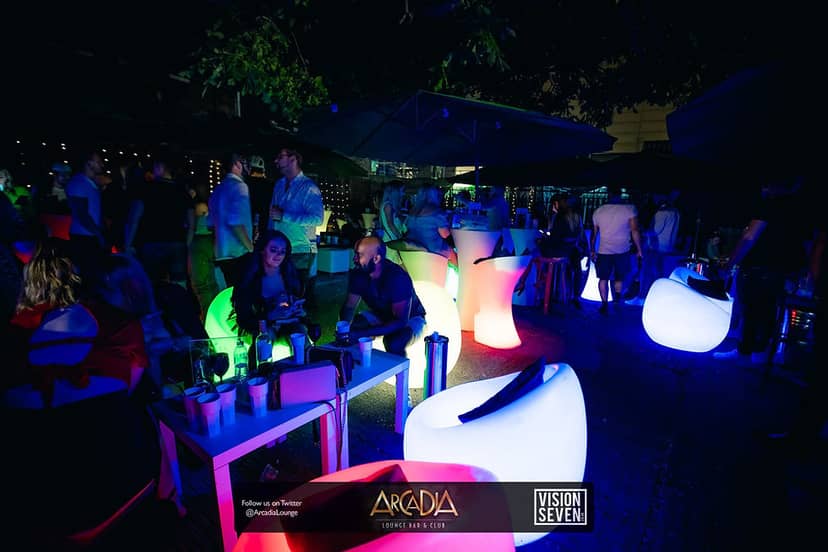 Penthouse outdoor event setup with stylish seating for networking at Arcadia Loungebar.