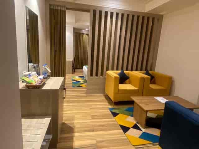 Modern Arcadia Hotel Board Room with vibrant yellow chairs for meetings and events.