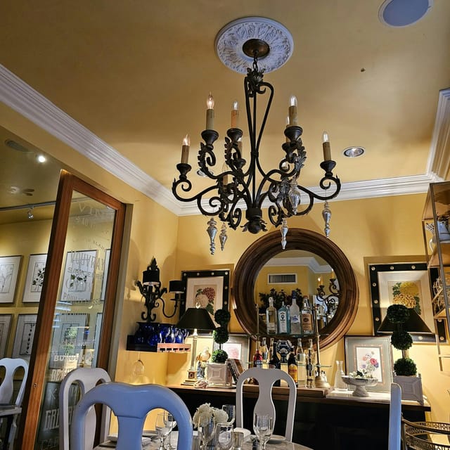 Elegant bakery venue with chandelier, perfect for intimate gatherings or receptions.
